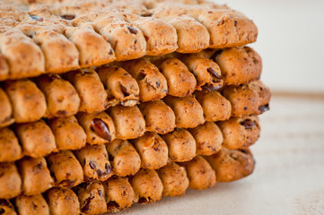 Dieting cookies with flax seeds and sunflower seeds and cracknels on the background