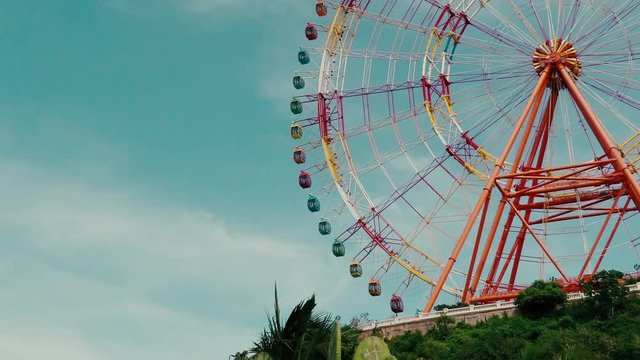 Design Layout or template for video editing. Mockup. A huge ferris wheel on a background of blue sky.