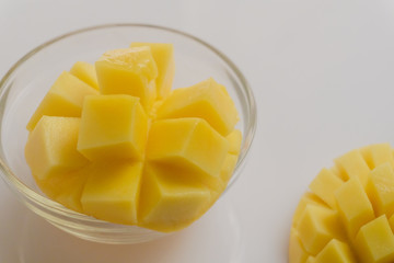 Yellow mango fruit on a white background