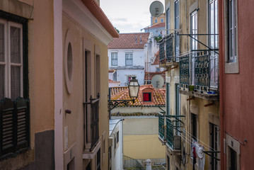 Houses on the narrow alley in Lisbon, capital city of Portugal