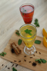 Top view on two glasses with colored hot drinks from which steam comes. winter hot seasonal vitemin drinks