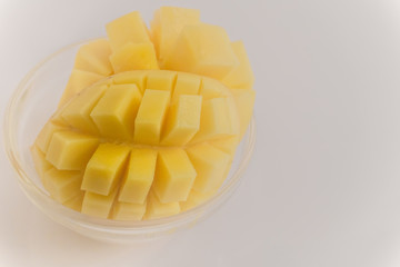 Yellow mango fruit on a white background