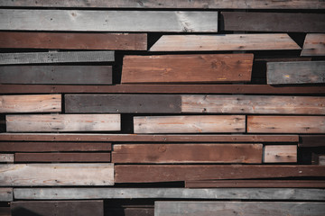 Wall of wooden boards with slits. Texture of old , brown wood