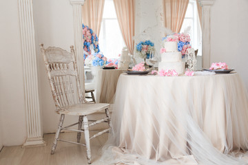 Beautiful design of the wedding table for the newlyweds. light luxury interior