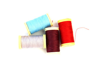 Spools of cotton thread isolated on white background