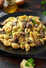 Carbonara mushrooms pasta Conchiglie with creamy sauce, parmesan cheese and herbs