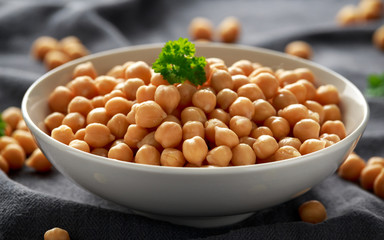 Fresh raw chickpeas in white bowl. Healthy food
