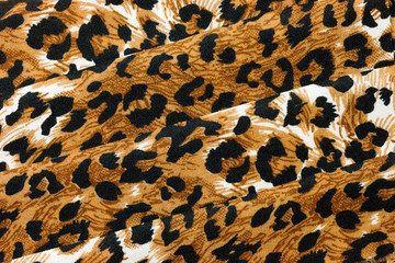 Abstract background of folded animal print fabric
