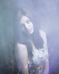 Fototapeta premium portrait of a pretty young woman. effect of clouds.isolated.