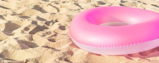 Inflatable circle on the sand. Space for text.