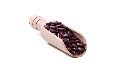 red kidney bean in wooden scoop isolated on white background. nutrition. food ingredient.