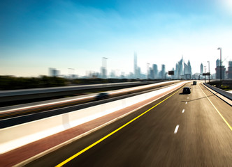 Dubai from the middle of the highway in speedy vehicle