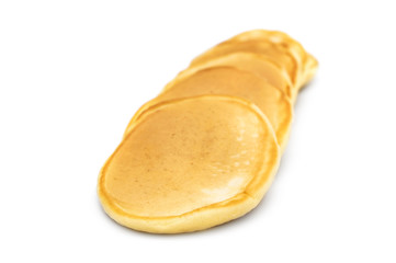 Row of fresh pancakes on white.