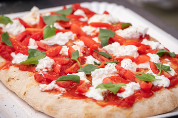 Pizza margherita with cherry tomatoes and basil