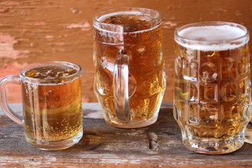 Mug of beer on wooden background. Octoberfest.
