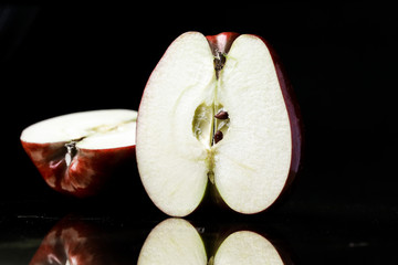 red apple black background