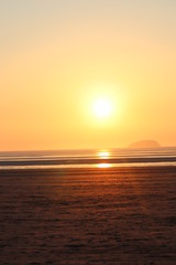 Sunset setting on beach Weston-super-Mare English coastline 