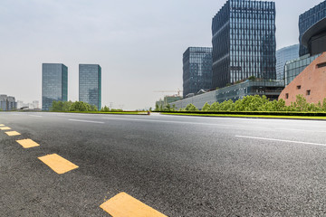 Panoramic skyline and modern business office buildings with empty road,empty concrete square floor