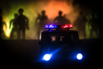Police cars at night. Police car chasing a car at night with fog background. 911 Emergency response pSelective focus