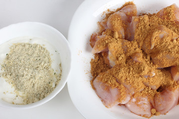 Piece of raw chicken meat on a white background