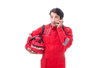 Young paramedic in red uniform isolated on white
