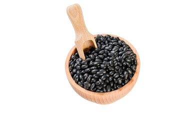 black bean in wooden bowl and scoop isolated on white background. nutrition. food ingredient.