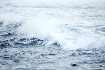 Ocean wave at black beach.