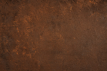 Dark brown textured surface with rust effect