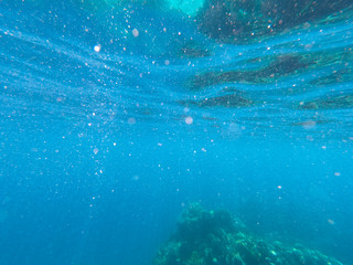 Beautiful texture of the sea and ocean water. blue background. Underwater photography. Red Sea, Egypt.
