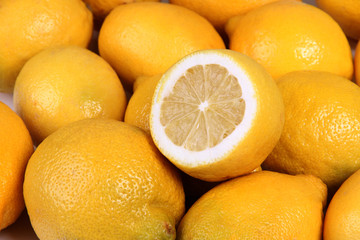 Ripe yellow lemon on table