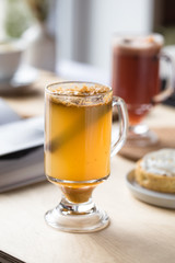 Autumn and winter drinks. Traditional home-made apple cider, cocktail of cider with aromatic spices - cinnamon and anise. 