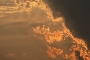 Sun rays through clouds like a dramatic explosion. Abstract nature background. 