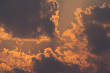 Sun rays through clouds like a dramatic explosion. Abstract nature background. 