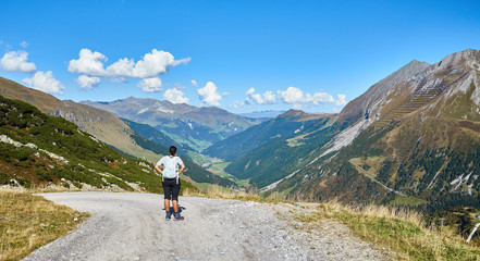 Fototapeta na wymiar Hiking Woman looking at Alps / Region of Tux and Hintertux in Austria