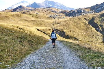 Woman hiking on a trail in the valley 