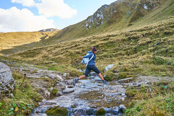 Woman hiking on a trail in the valley 