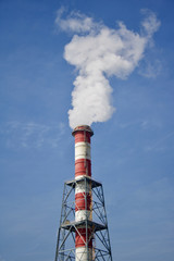 High industrial chimney with a smoke