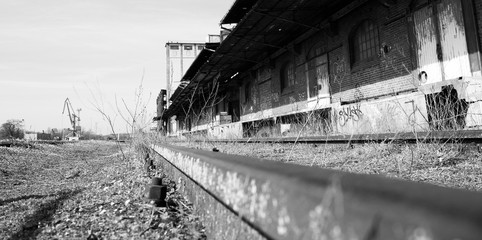A railroad next to ruined store