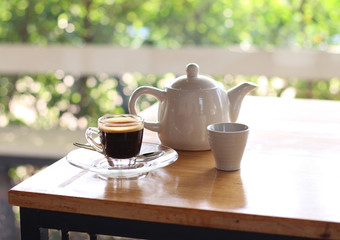 Woman drinking coffee and tea in a cafe