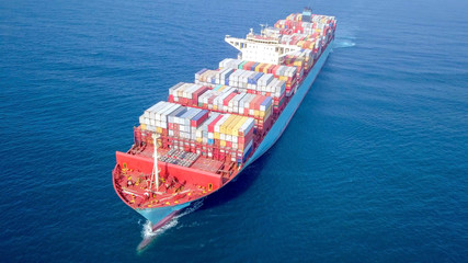 Ultra large container vessel (ULCV 366 Meters long) loaded with various Container brands, at sea -...