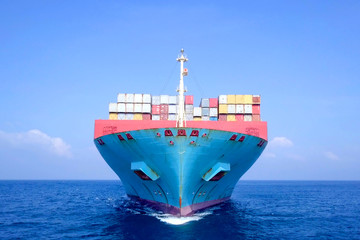 Ultra large container vessel (ULCV 366 Meters long) loaded with various Container brands, at sea - Aerial image. © STOCKSTUDIO