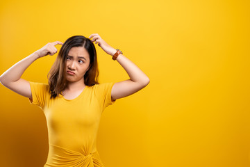 Woman scratching her head