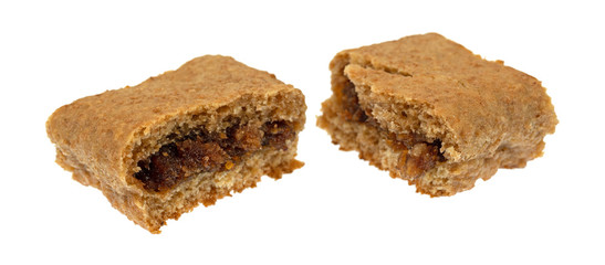 Side view of a single blueberry fig bar broken in half isolated on a white background.