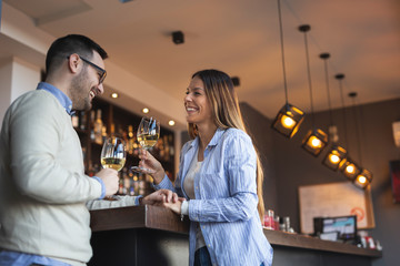 Couple in a restaurant drinking wine