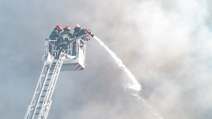 Firefighters extinguish a fire