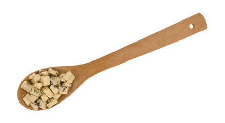 Small portion of crumbled blue cheese on a wood spoon on a white background.