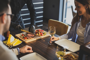 Restaurant chef slicing steak
