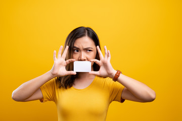 Angry woman covering face with paper card