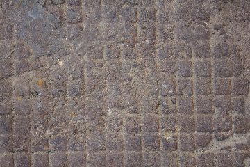 blue gray old checkered iron surface with dirt and bumps. rough texture