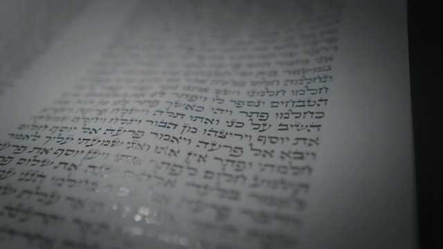Cinematic shot of original, hand-crafted Torah scroll